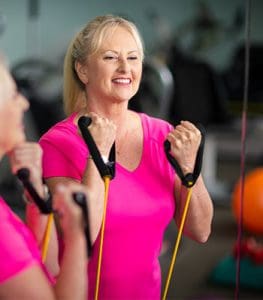 Woman exercising in a gym.